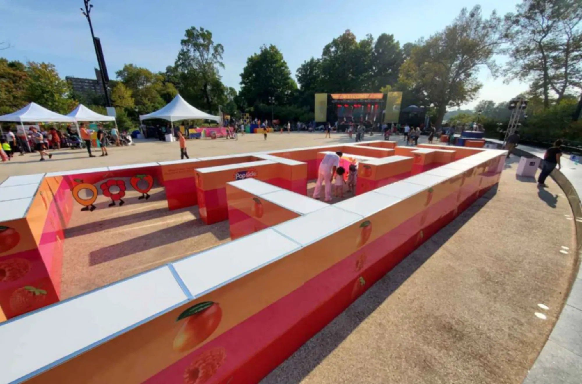Wide view of an outdoor branded maze activation built with T3