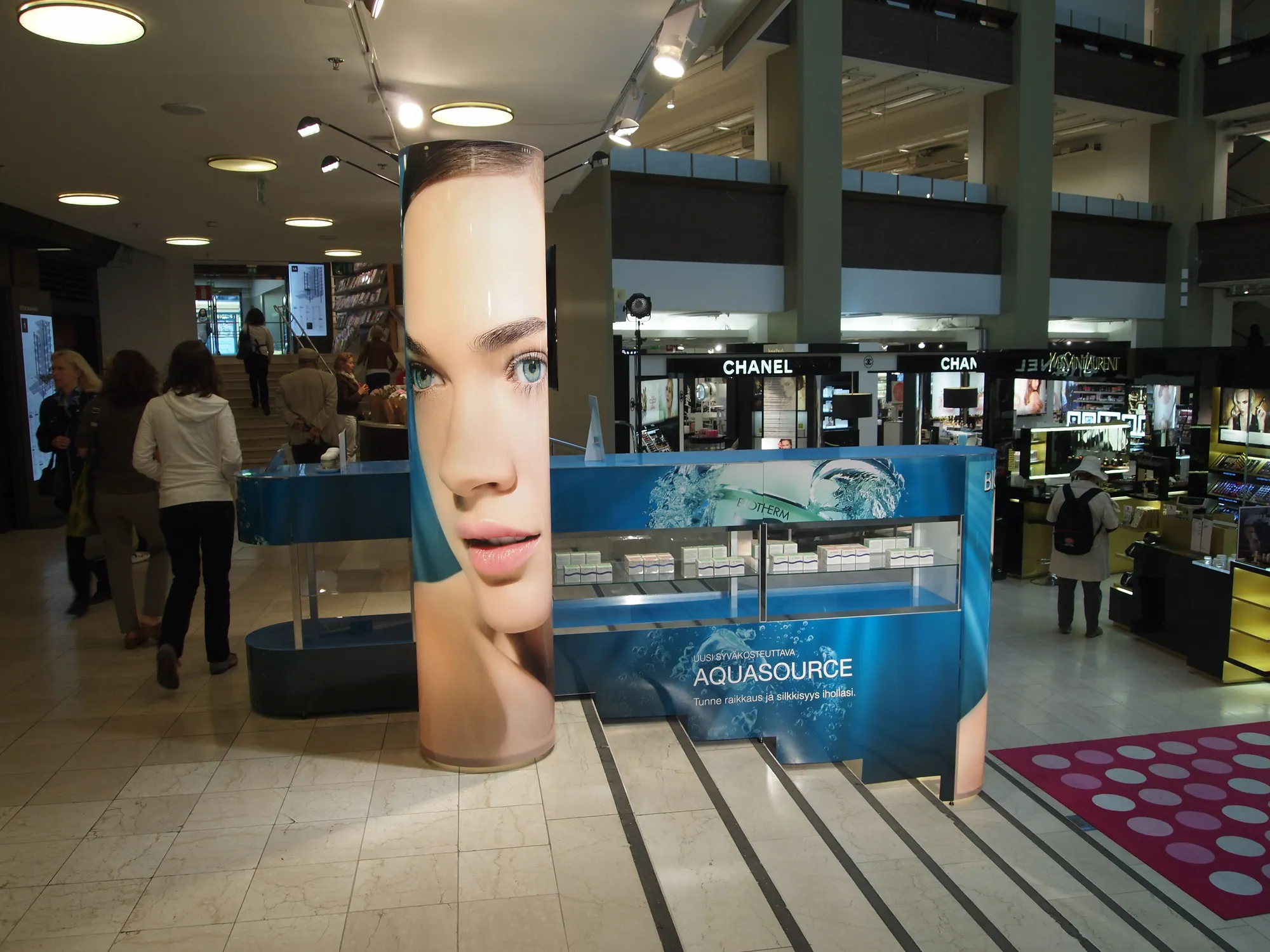 Cosmetics promotion counter with curved fabric towers built with T3