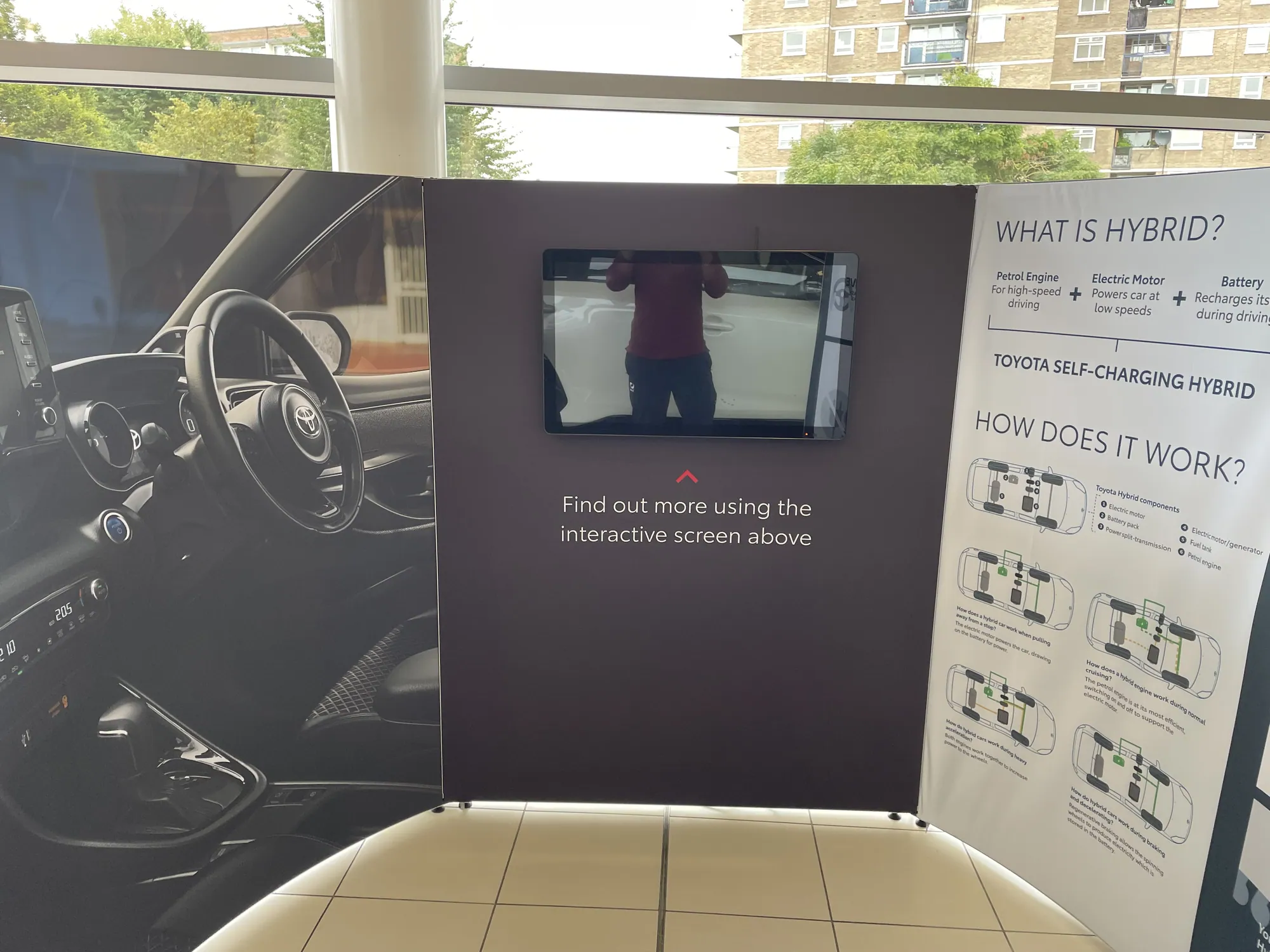 Interactive information wall with screen built with T3 in a car showroom