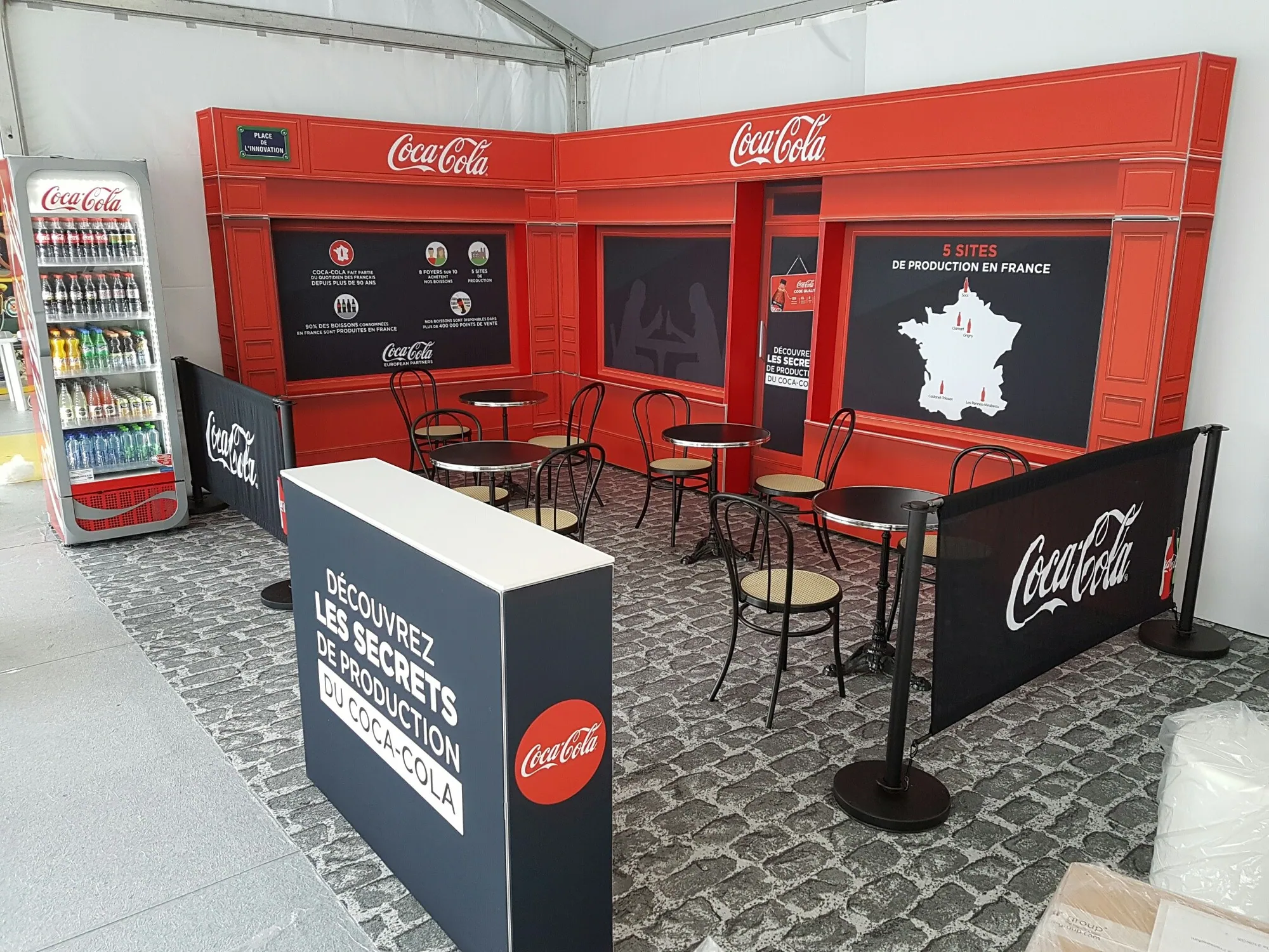 Branded café seating area enclosed by T3 graphic walls