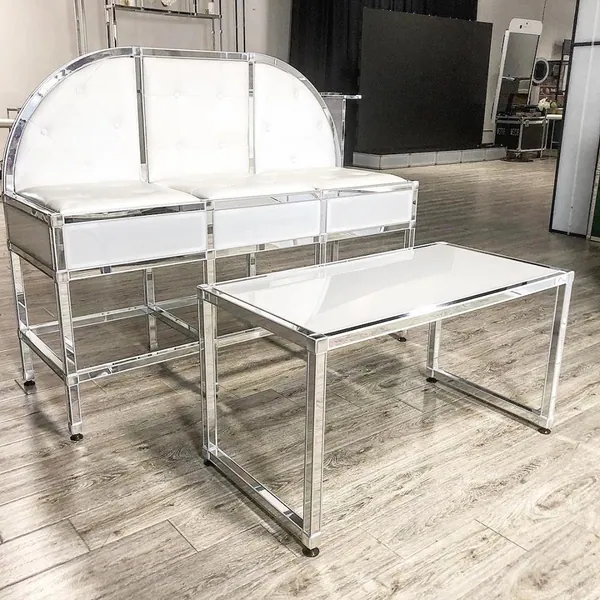 White upholstered lounge sofa and coffee table on a chrome T3 frame