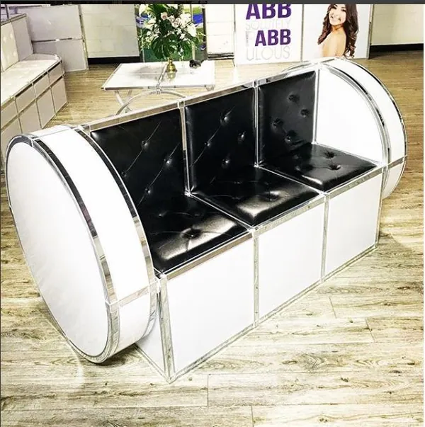Black buttoned lounge sofa with rounded chrome T3 frame ends
