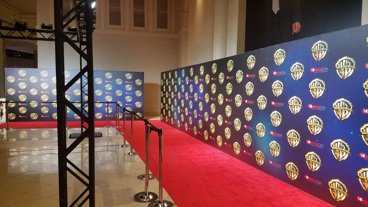 Long red-carpet step-and-repeat media wall built with T3 for a film premiere