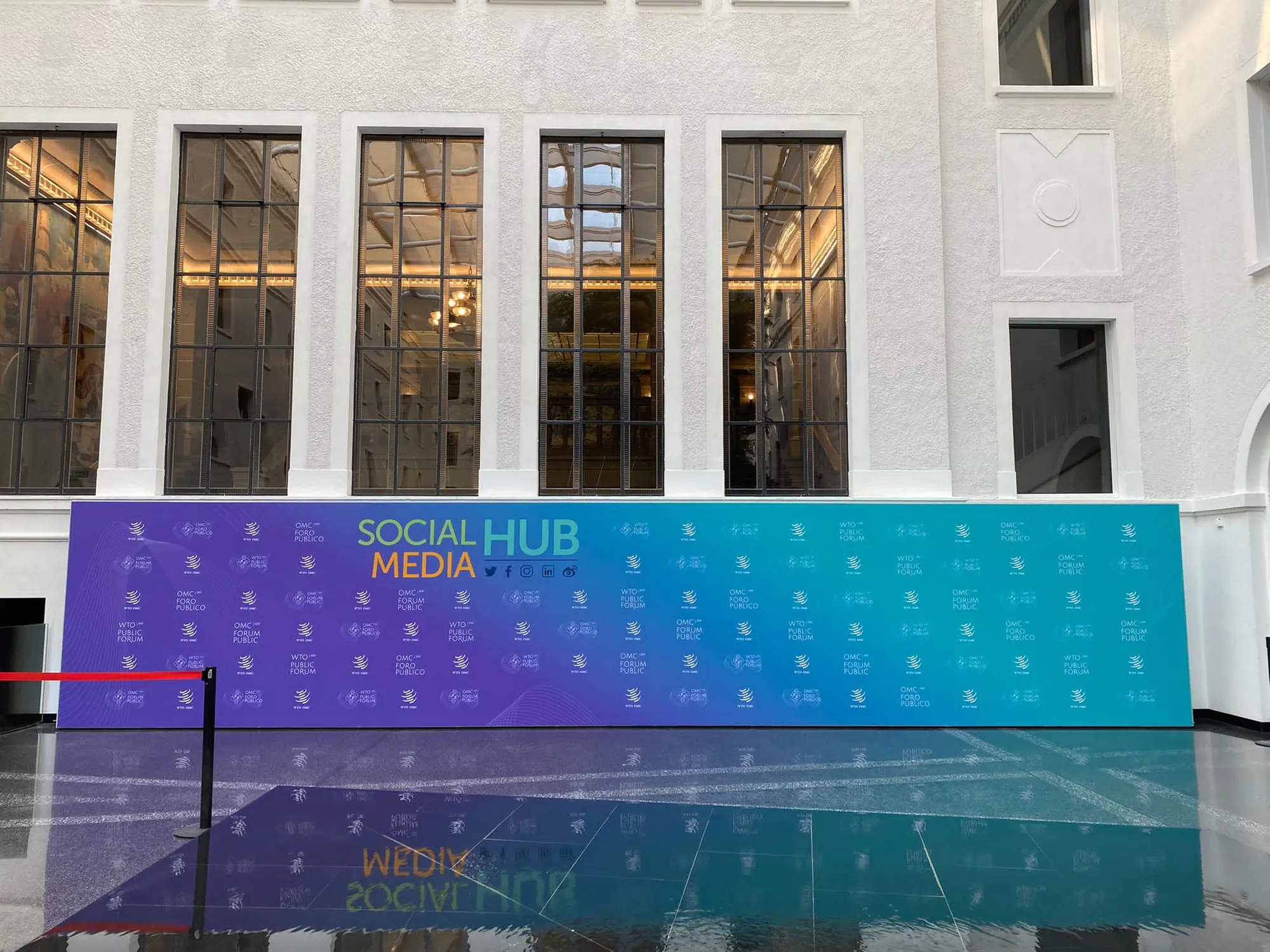 Front view of a long step-and-repeat media wall built with T3