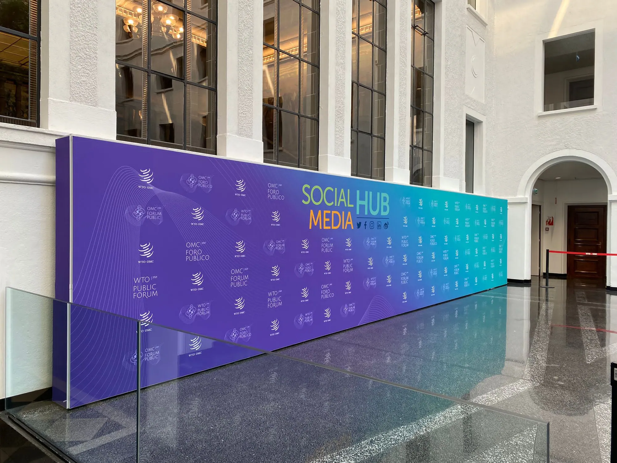Long illuminated media wall built with T3 in a historic building