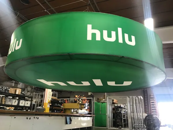 Large circular hanging fabric sign built with T3