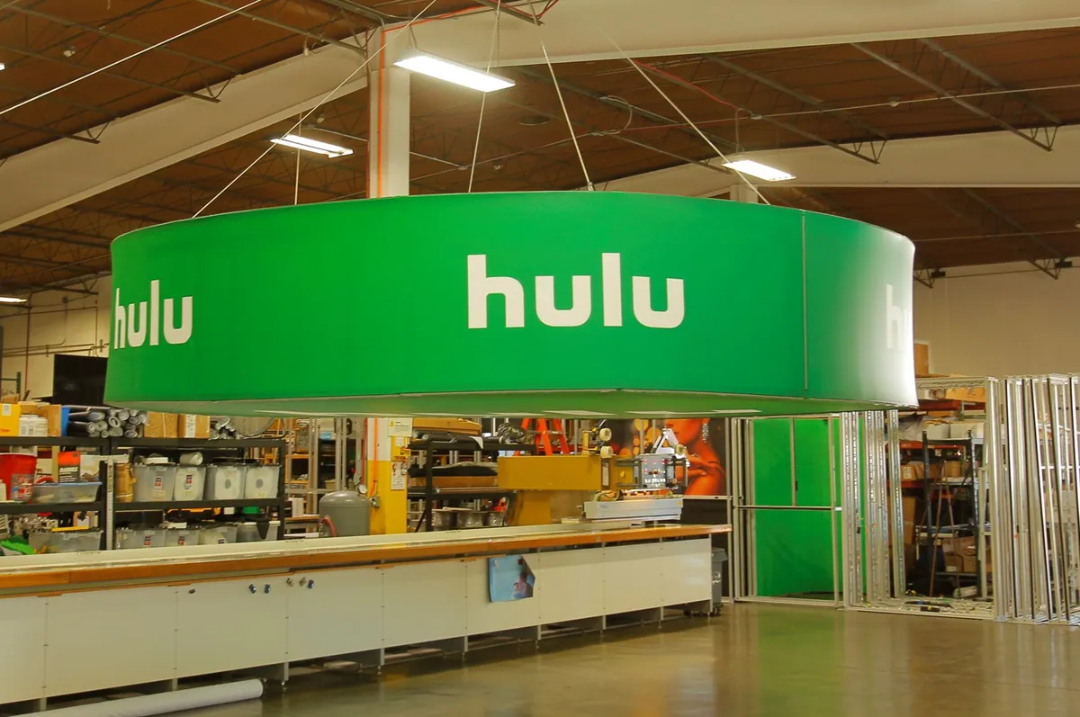 Circular hanging fabric sign built with T3 during fabrication