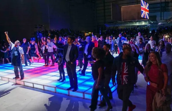 Guests dancing on an LED dance floor built with T3 at a corporate party