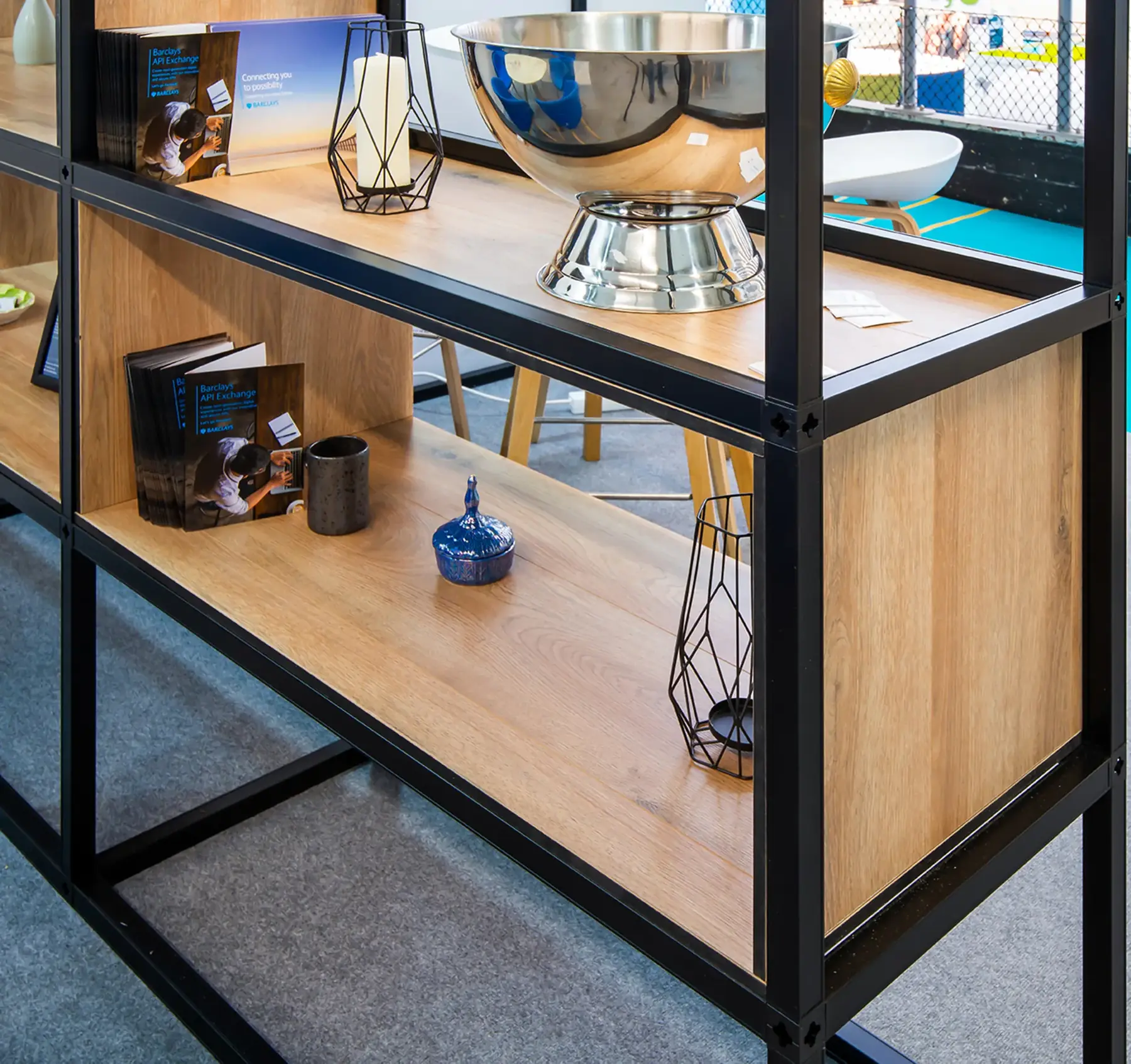 Black T3 Deco frame shelving with timber shelves and decor