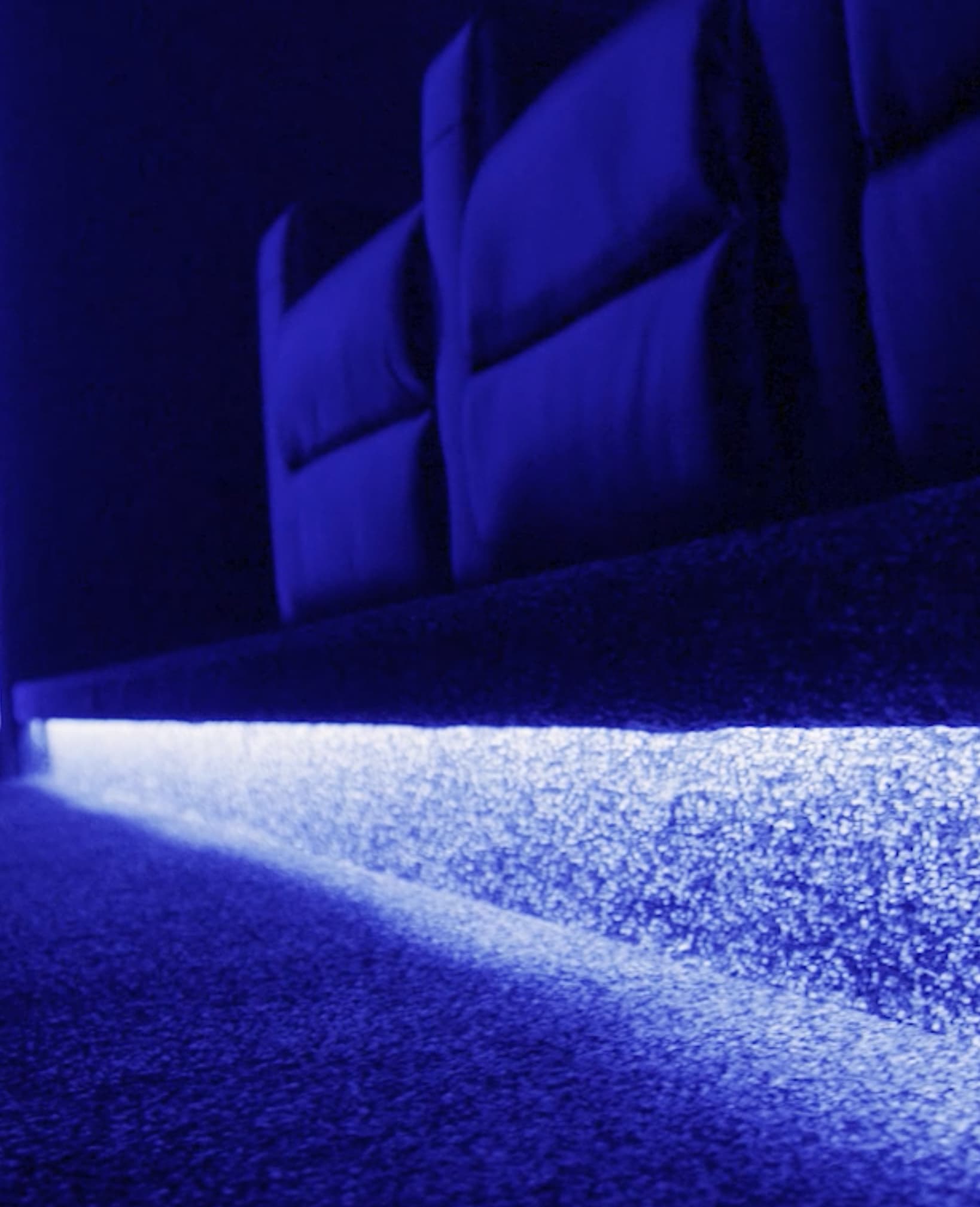 a blue light on a carpet