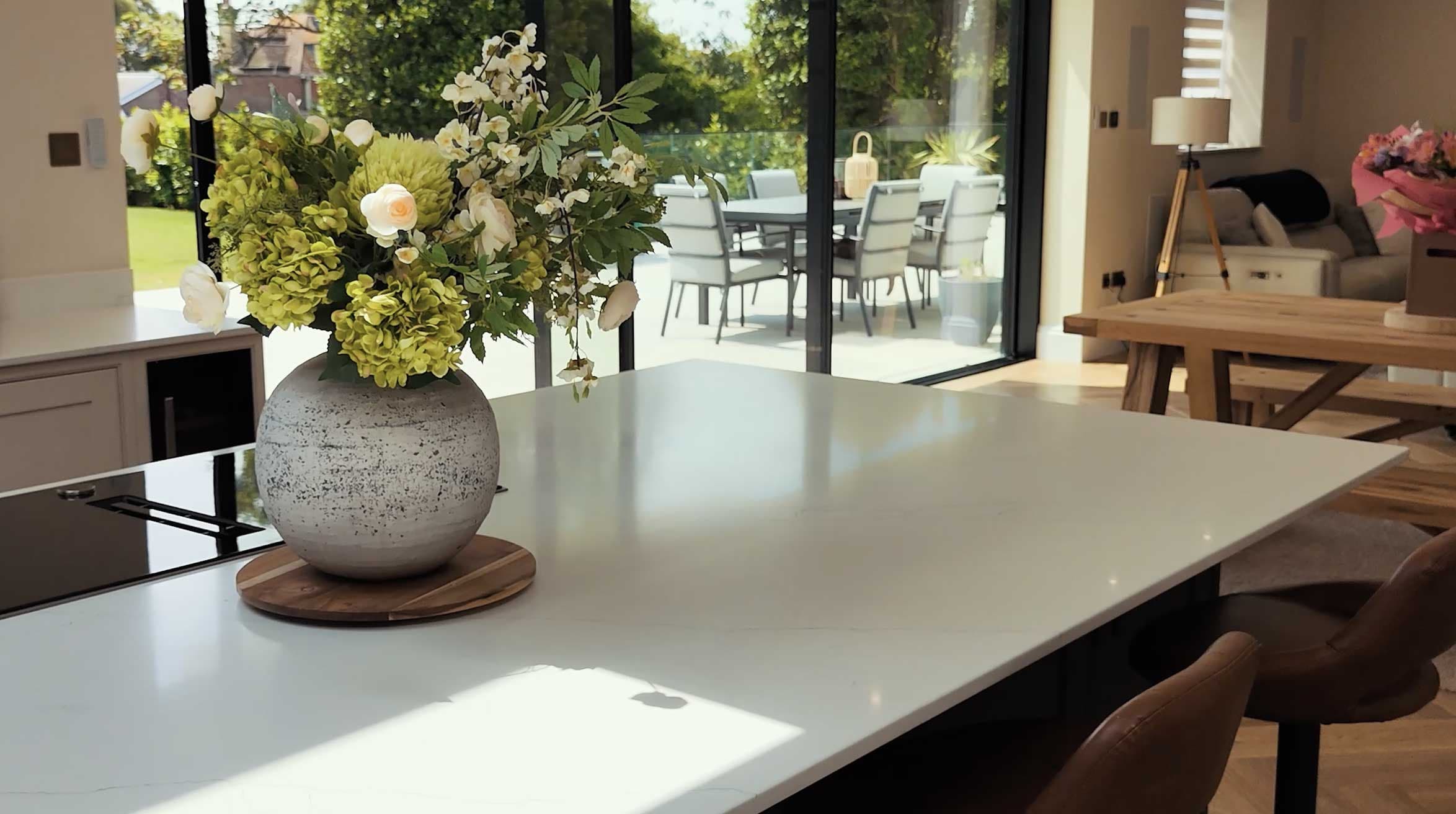 a vase with flowers on a table
