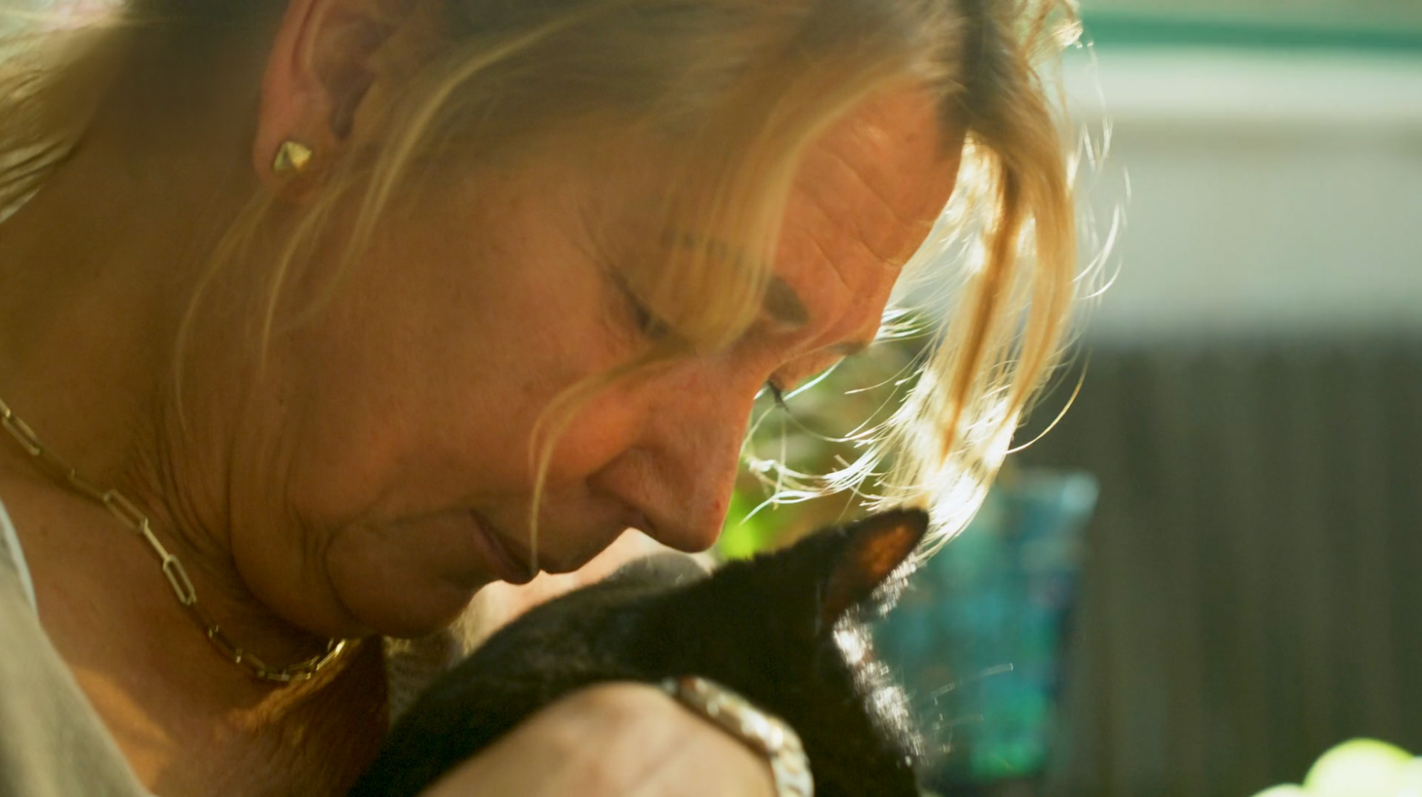a woman holding a cat