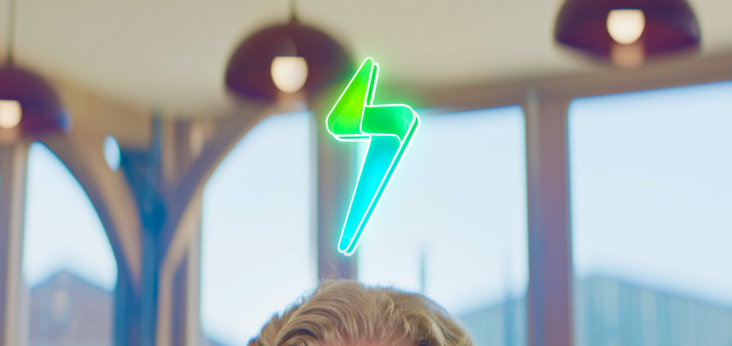 a green lightning bolt on a person's head