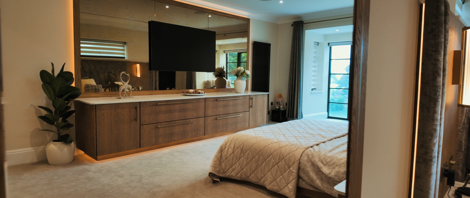 a bedroom with a large mirror and a bed