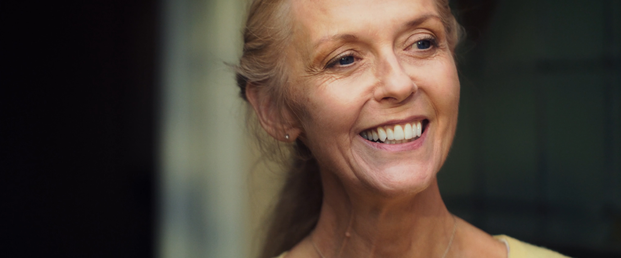 a close-up of a woman smiling