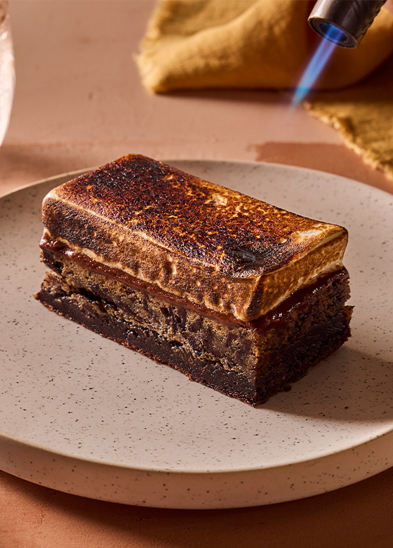 House-made S'mores dessert featuring layers of chocolate mousse, graham cracker, and toasted marshmallow at Saint & Second.
