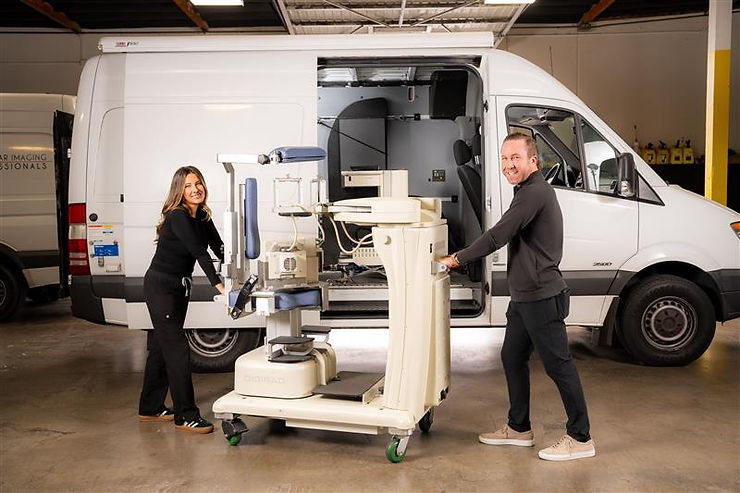 VIP Imaging mobile nuclear imaging van with clinical staff unloading state-of-the-art cardiac imaging equipment for an on-site imaging day at a cardiology practice