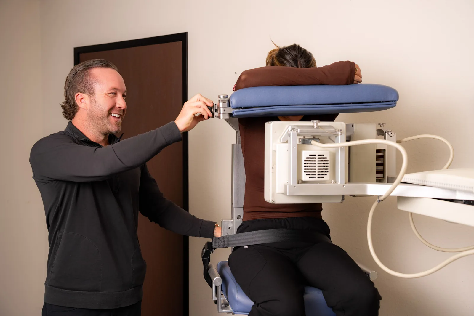 VIP Imaging technologist positioning a patient on a SPECT camera at a cardiology practice