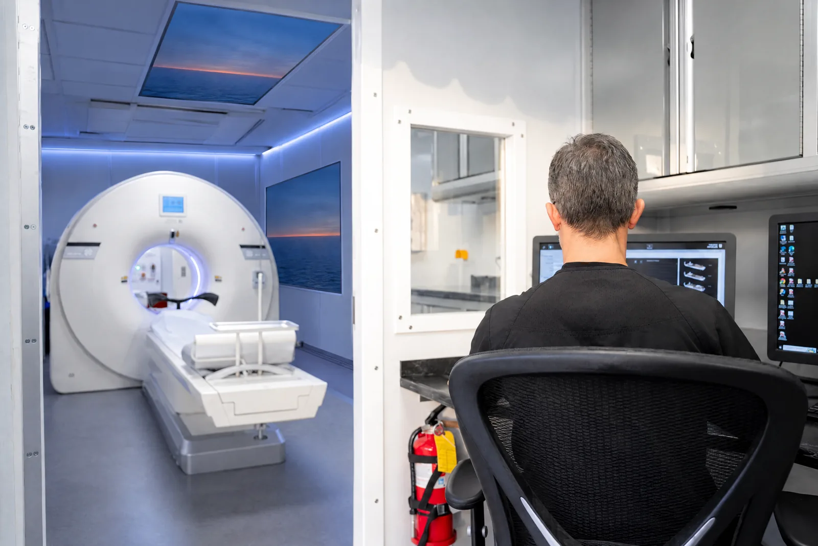 Technologist at the console inside the VIP Imaging PET/CT trailer