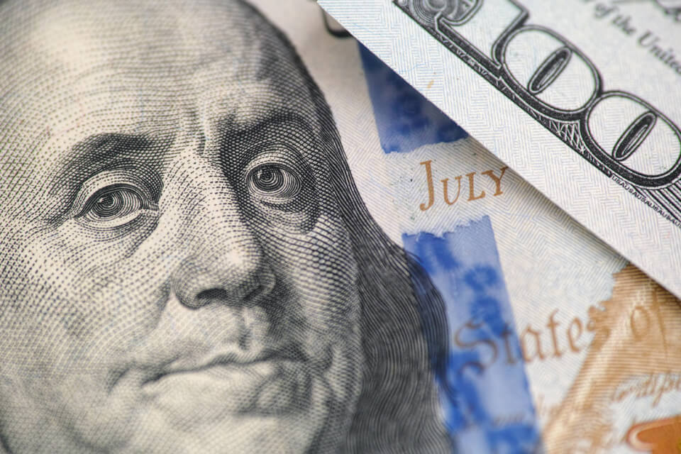 Close-up of a 100-dollar bill featuring Benjamin Franklin.