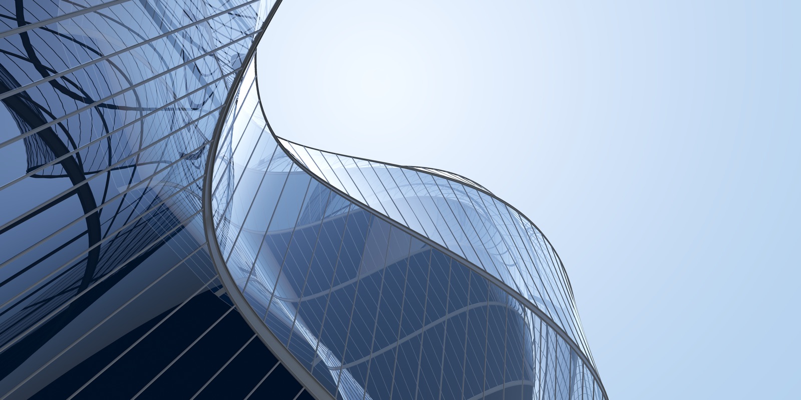 Curved glass towers reflect a clear sky, seen from street level.