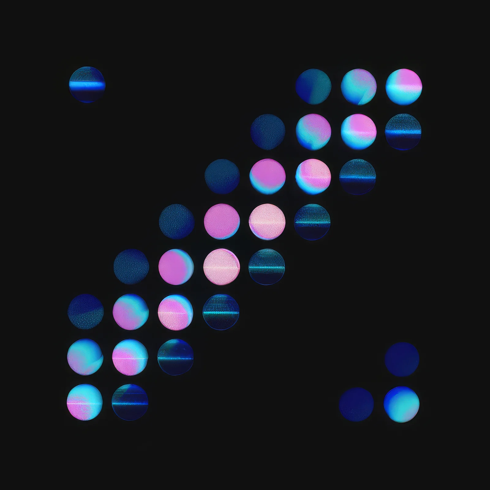Glowing pink and blue discs drift in a diagonal band across a black field, a still from the article's motion piece