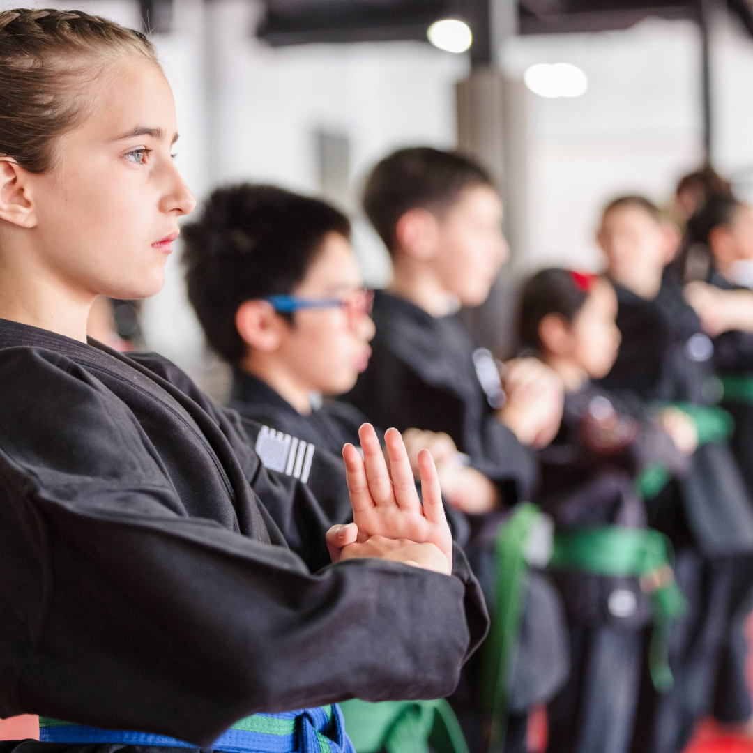 Adolescent Karate Girl meditating before class.