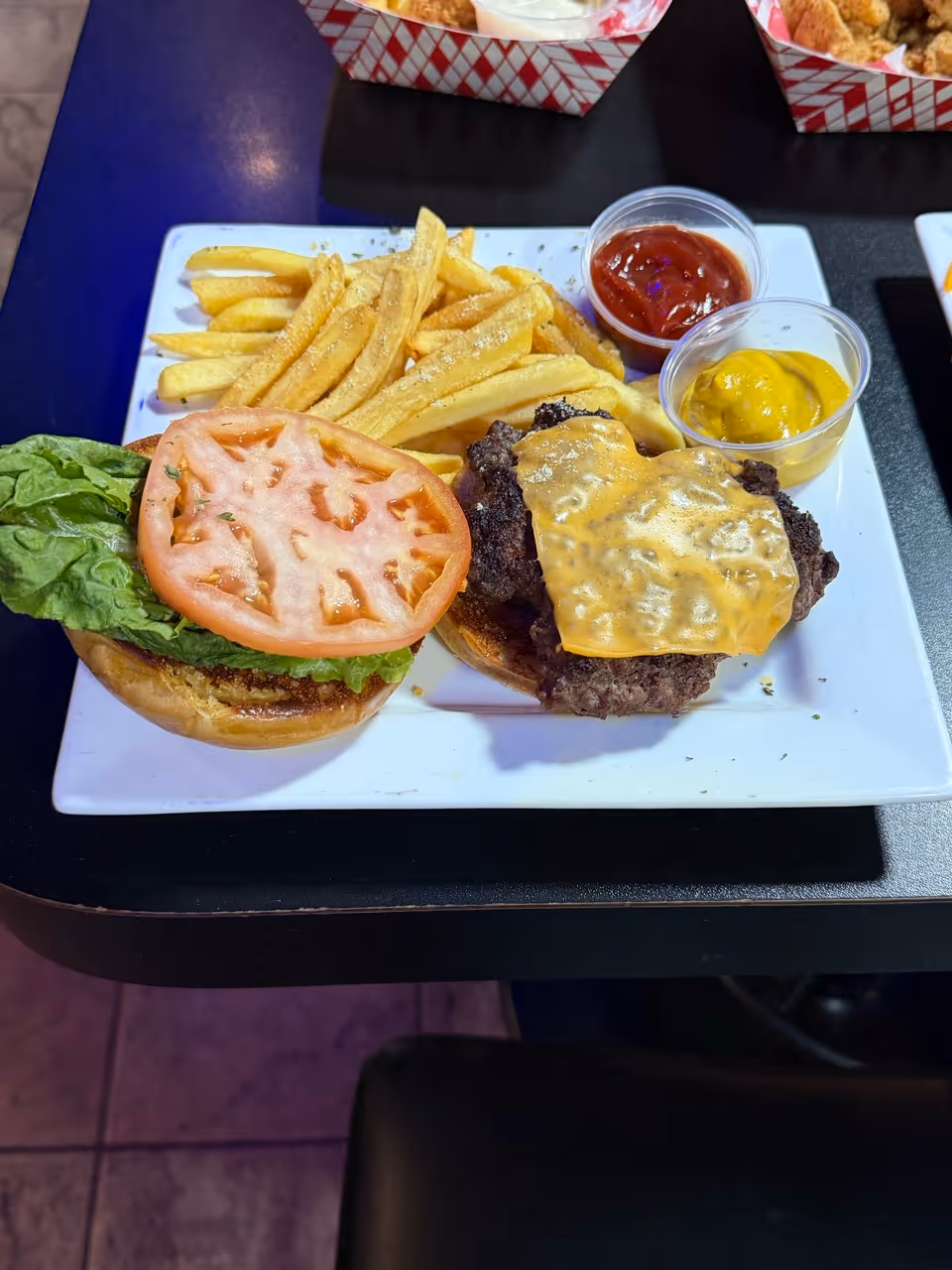 cheese burger with fries on the side