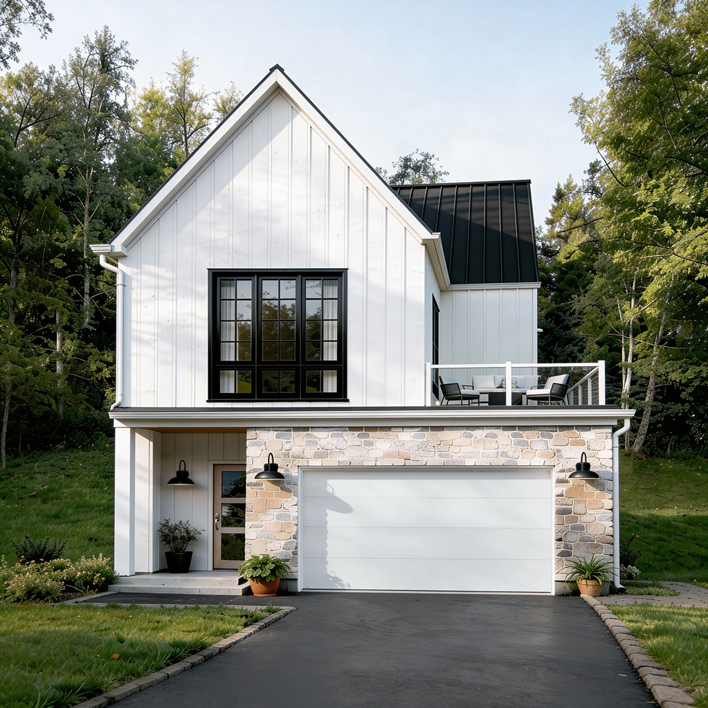 Maison moderne à deux étages avec extérieur blanc, grande fenêtre noire, toit en métal noir et garage blanc encadré de pierre, entrée avec porte en verre, terrasse au premier étage avec mobilier de jardin, pelouse verte et arbres en arrière-plan.