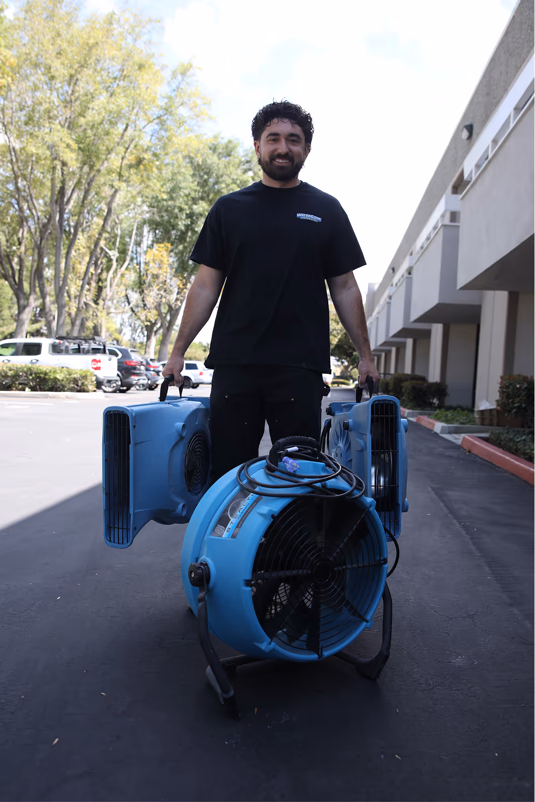 Water Gone Restoration technician with a commercial drying blower on site