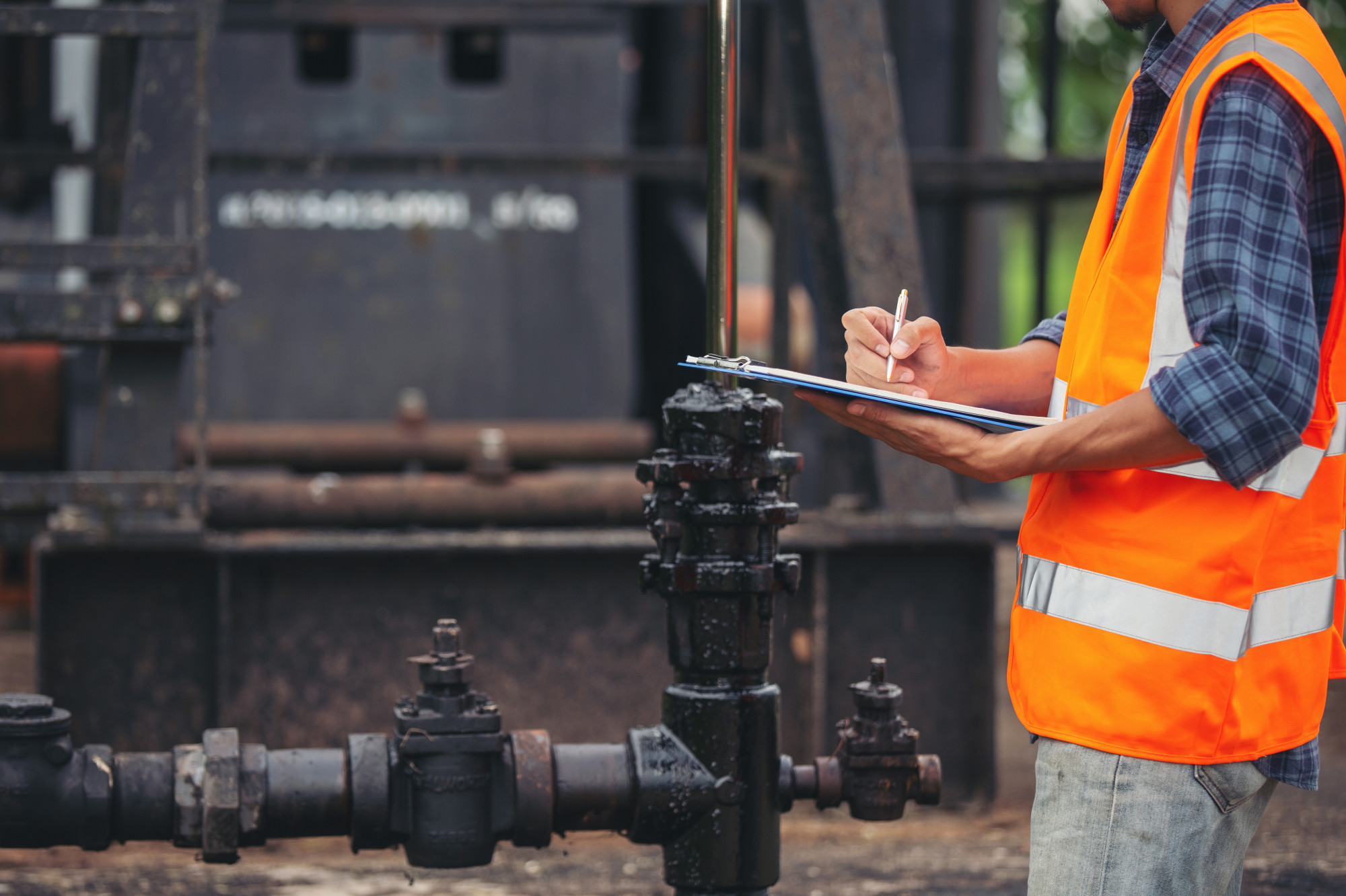 engineer writing compliance inspection field report