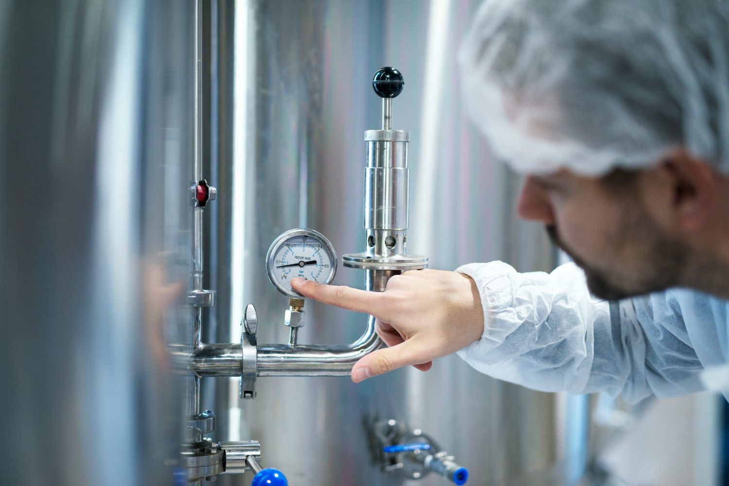 inspector reviewing pressure vessel report