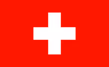 White cross centered on a red background, representing the flag of Switzerland.