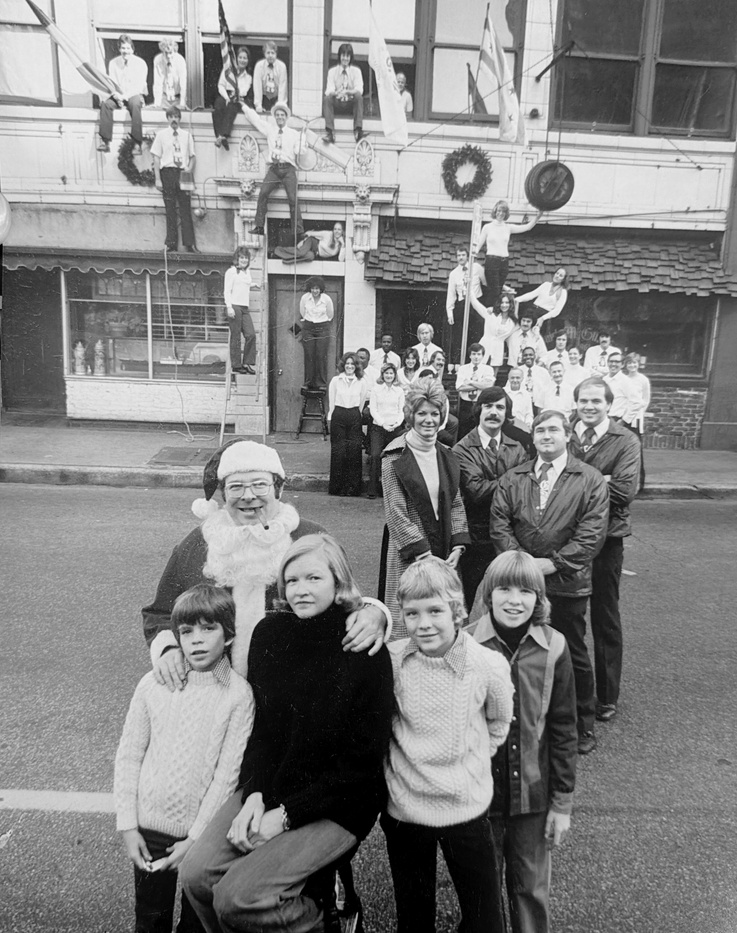 A vintage Christmas family photo outside Butch McGuire's