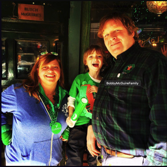 Bobby McGuire and family outside Butch McGuire's on Division Street