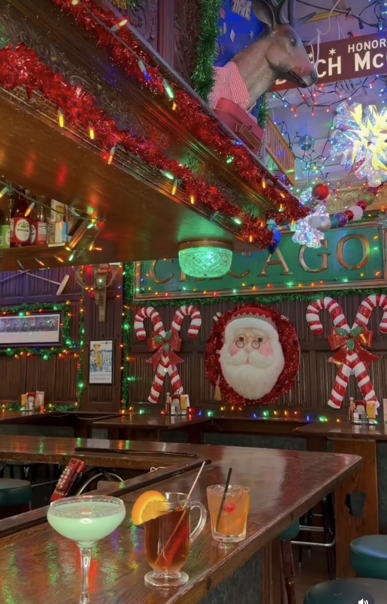 Holiday cocktails on the bar with Santa and candy cane decorations