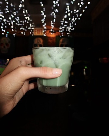 Christmas on the Rocks cocktail with holiday lights