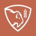 White bison head and wheat stalk emblem inside a shield on a terracotta background.