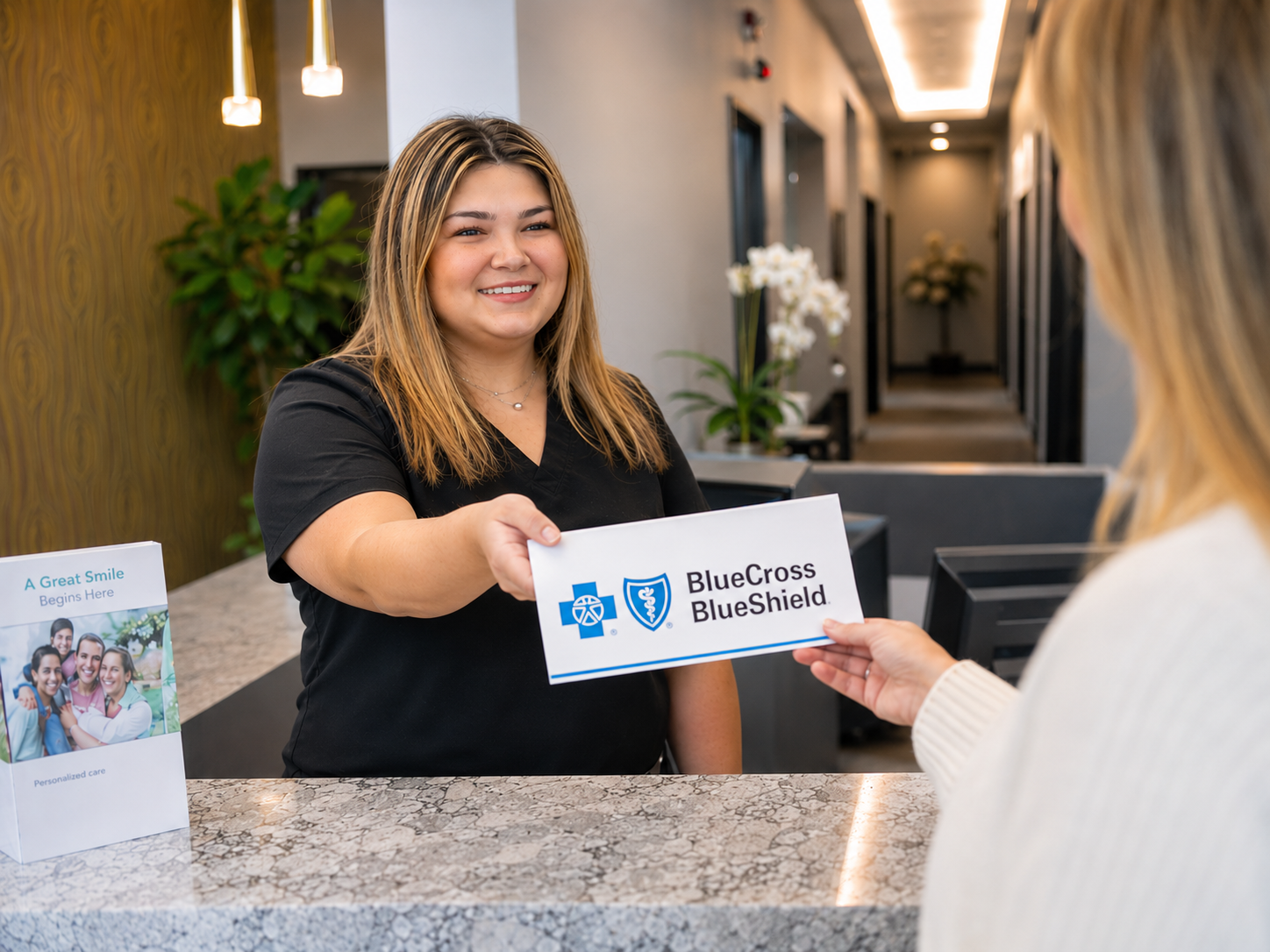 Patient checking in at Comfydent Smiles in Bee Cave, TX with Blue Cross Blue Shield dental coverage