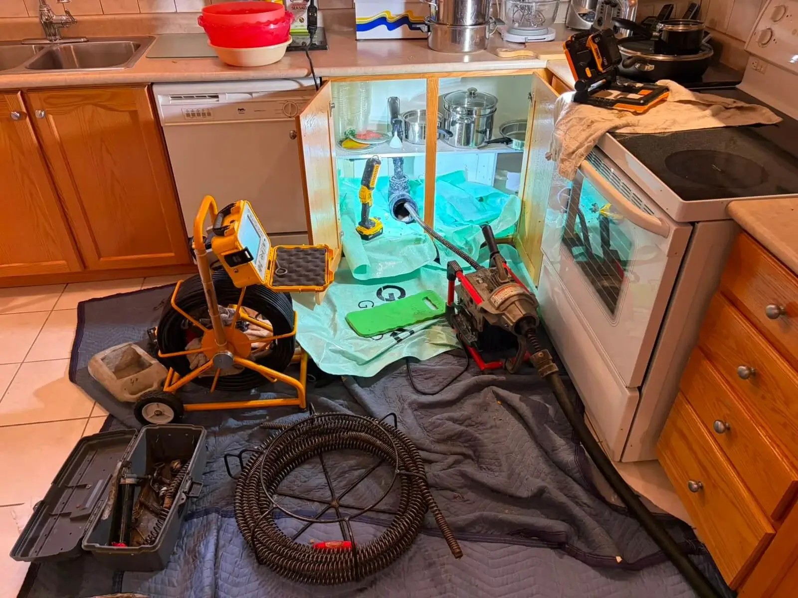 Professional kitchen drain cleaning setup with drain camera and flex-shaft equipment - Hive 5 Plumbing Vaughan