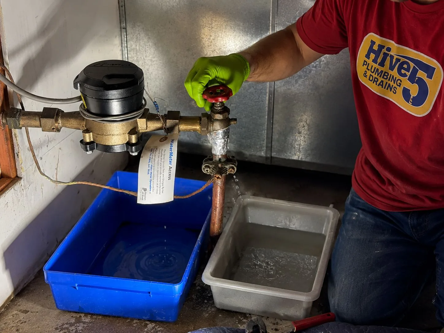 Hive 5 plumber working on a main water shut-off valve