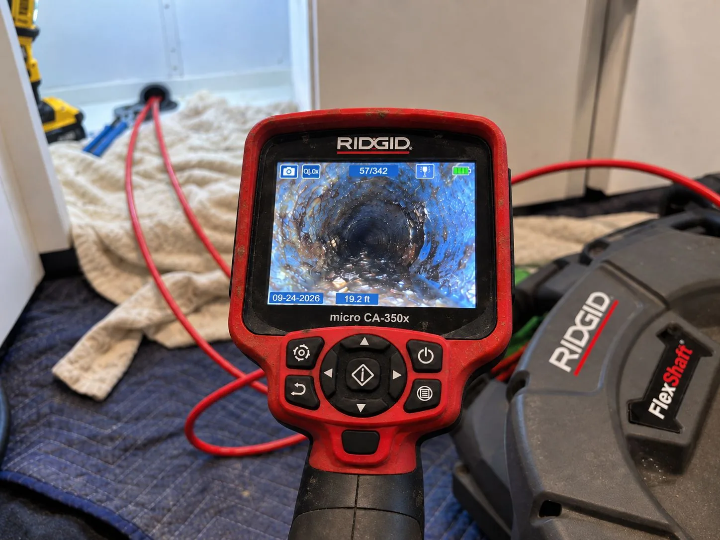 Drain camera displaying the inside of a pipe during a residential drain line inspection.