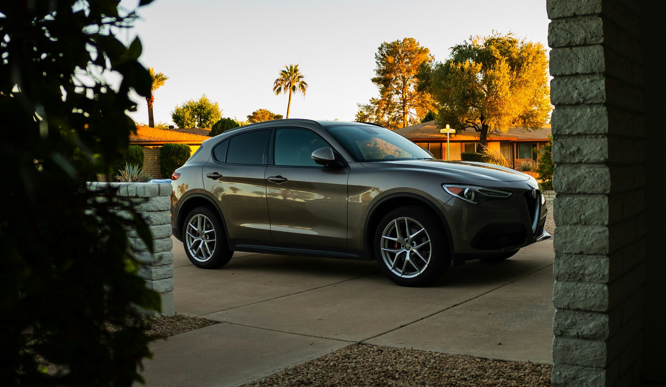 Alfa Romeo Stelvio in Scottsdale Arizona driveway at golden hour