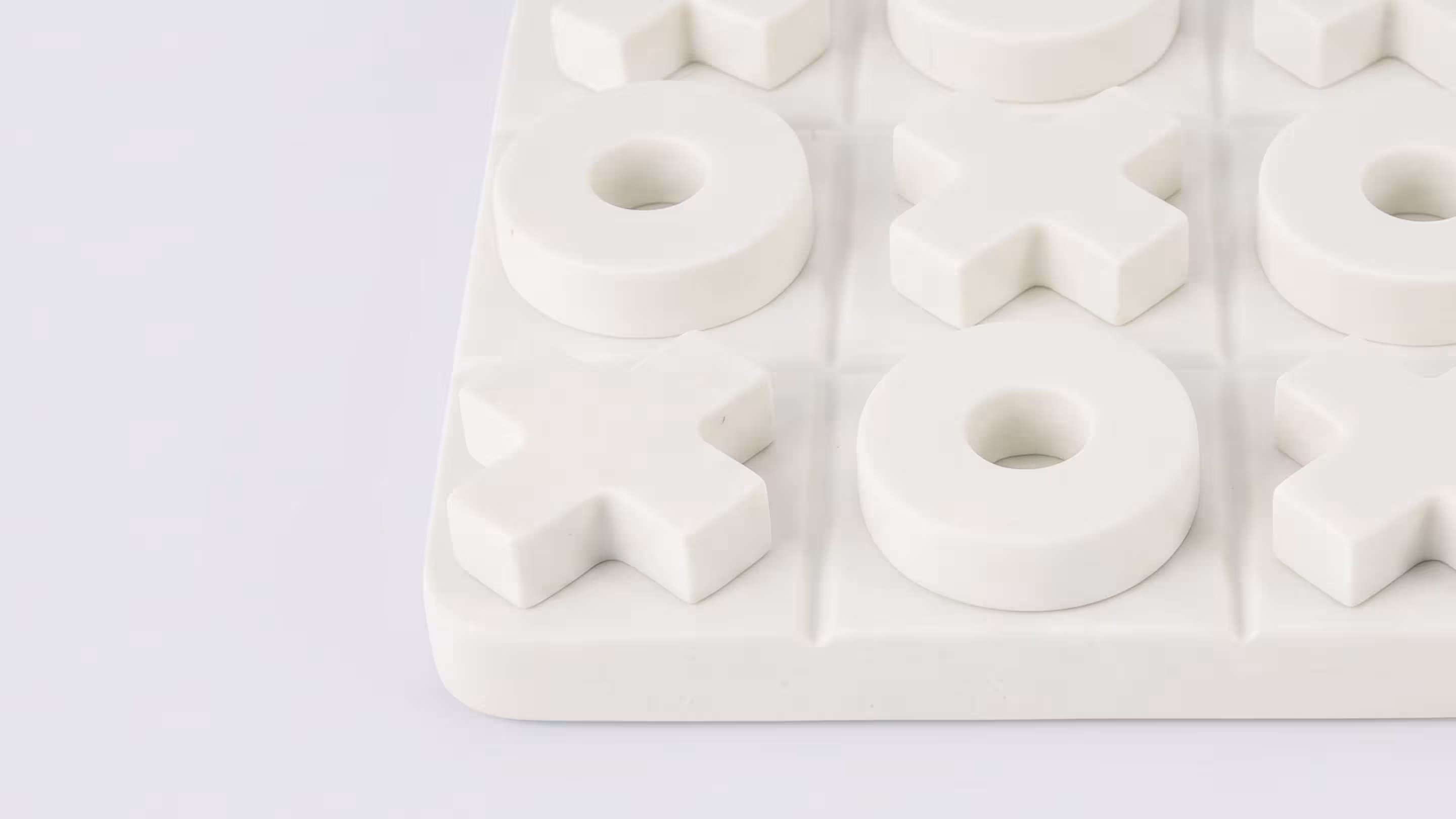 White noughts and crosses decor object at BLANK The Studio for playful minimalist set styling.