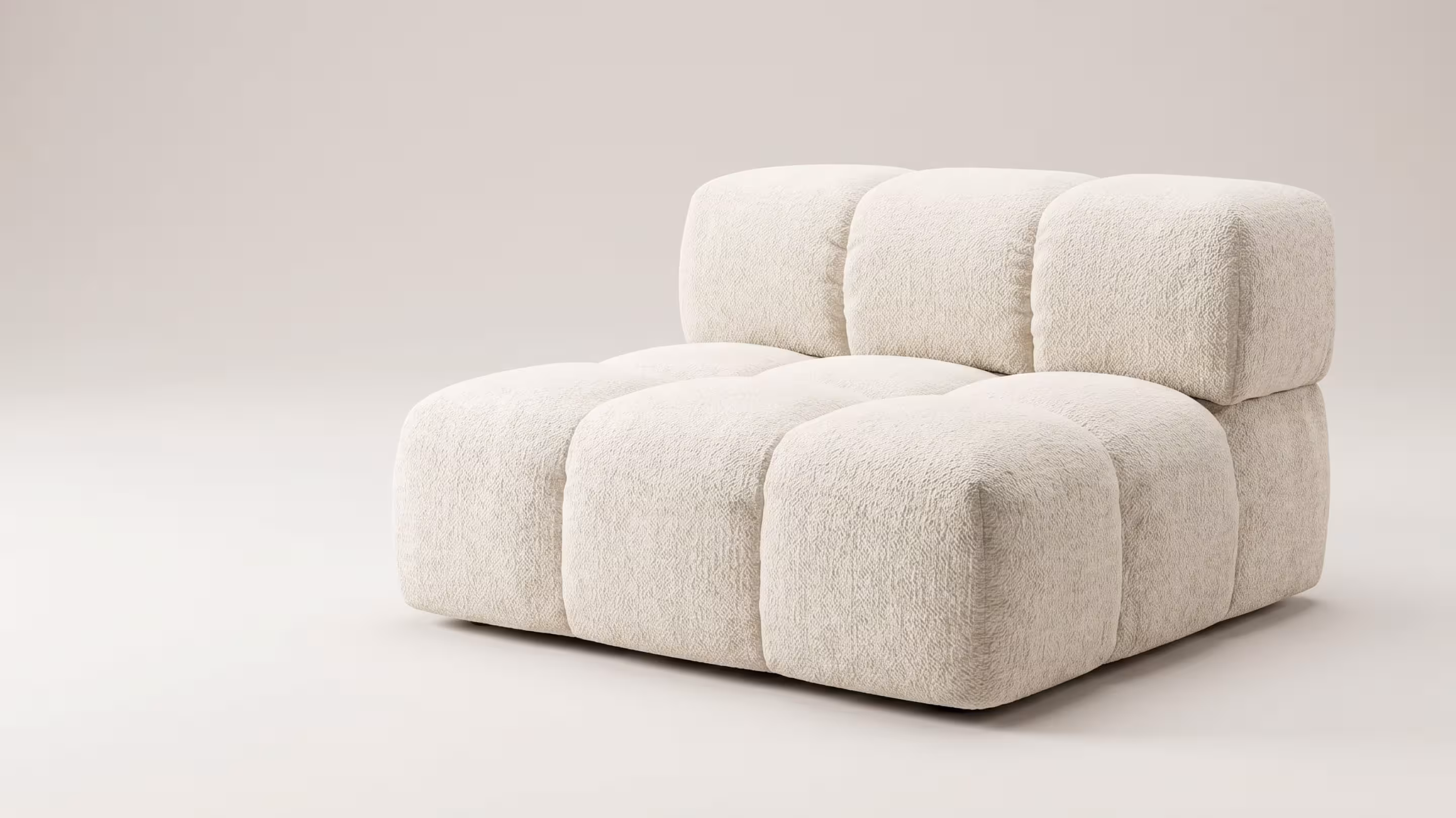 Cubed sofa chair at BLANK The Studio, a neutral modular seat for modern photography and content sets.