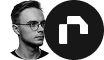 Man with glasses and beard looking to the left in black and white photo next to a white N logo on black circle.