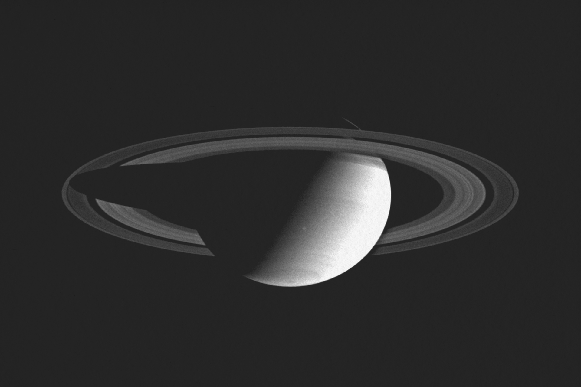 A detailed, high-resolution photograph of the planet Saturn and its prominent ring system against the black backdrop of space.