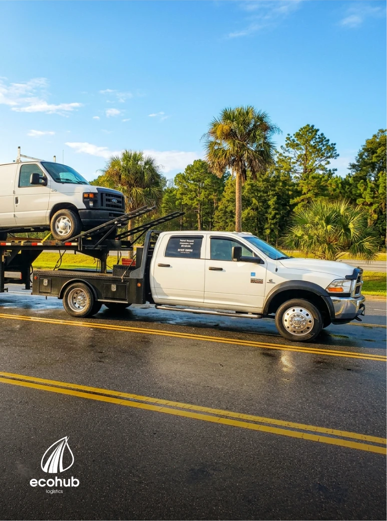 Car hauler moving vehicles in Sanford, FL for EcoHub Logistics auto transport services.