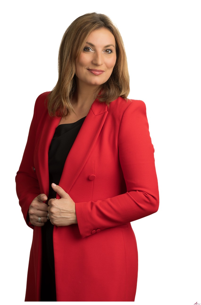 CTV News anchor Maria Panopalis in a red blazer, three-quarter length headshot on white