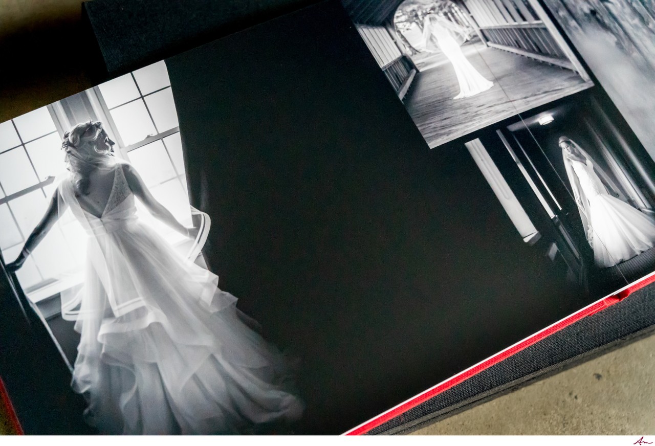 Handmade Italian wedding album open on a table